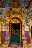 Luang Prabang, Laos - Wat Pa Phai the 'Bamboo Forest Monastery', the main doorway gilded and covered with mosaics. 